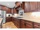 Gourmet kitchen featuring granite counters, custom cabinets, and stainless-steel refrigerator at 2571 Weddington Ne Rdg, Marietta, GA 30068