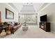 Large living room featuring a decorative ceiling, sofa, fireplace and large windows at 2571 Weddington Ne Rdg, Marietta, GA 30068