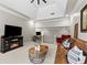 Living room with a vaulted ceiling, leather sofa, fireplace and a tv at 2571 Weddington Ne Rdg, Marietta, GA 30068
