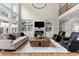 Spacious living room with soaring ceilings, built-in shelving, and a cozy fireplace at 2571 Weddington Ne Rdg, Marietta, GA 30068