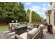 Outdoor patio area with comfortable seating, fire pit table, and gas heater at 2571 Weddington Ne Rdg, Marietta, GA 30068