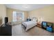 Bedroom with neutral decor, carpet, and a window that provides natural light at 3125 Crooked Stick Dr, Cumming, GA 30041