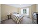 Cozy bedroom with large window and neutral decor at 3125 Crooked Stick Dr, Cumming, GA 30041