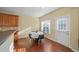 Cozy dining area with hardwood floors, a small table and chairs, and a window at 3125 Crooked Stick Dr, Cumming, GA 30041