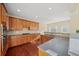 Stylish kitchen with wood cabinets, tile backsplash, and stainless oven at 3125 Crooked Stick Dr, Cumming, GA 30041