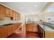 Open kitchen with stainless oven, tile backsplash, and hardwood floors at 3125 Crooked Stick Dr, Cumming, GA 30041