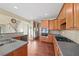 Spacious kitchen with stainless appliances, wood cabinets, and breakfast bar at 3125 Crooked Stick Dr, Cumming, GA 30041