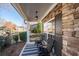 Cozy front porch showcasing seating, stone accents, and neighborhood views for relaxed outdoor living at 3125 Crooked Stick Dr, Cumming, GA 30041