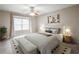 Nicely staged bedroom with a ceiling fan, neutral walls, large window, and coordinated decor at 14 Muncy Se Ct, Smyrna, GA 30080