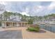 Community clubhouse overlooking the lake, with ample seating and lush landscaping at 14 Muncy Se Ct, Smyrna, GA 30080