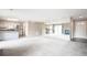 Open-concept layout featuring a mirrored wall reflecting the kitchen and fireplace, enhancing the sense of spaciousness at 14 Muncy Se Ct, Smyrna, GA 30080
