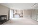 Spacious living area with a fireplace, sliding glass doors, and an open-concept kitchen in a neutral color palette at 14 Muncy Se Ct, Smyrna, GA 30080