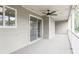 Covered porch with a ceiling fan, sliding glass doors, and plenty of space to relax and enjoy the outdoors at 14 Muncy Se Ct, Smyrna, GA 30080