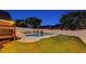 Spacious backyard featuring a large in-ground pool, green lawn, and privacy fencing at 1408 Aramore Dr, Conyers, GA 30013