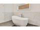 Stylish bathroom with a modern tub, sleek tile, and contemporary fixtures at 1408 Aramore Dr, Conyers, GA 30013