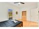 This bedroom shows a bookshelf with drawers next to a window with blinds at 1408 Aramore Dr, Conyers, GA 30013