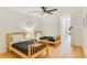 Bright bedroom featuring two beds, hardwood floors, and a ceiling fan at 1408 Aramore Dr, Conyers, GA 30013