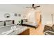 Bright bedroom featuring a futon, two beds, and hardwood floors at 1408 Aramore Dr, Conyers, GA 30013