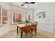 Bright breakfast nook with large windows, tile flooring and wooden chairs at 1408 Aramore Dr, Conyers, GA 30013