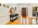 Welcoming foyer with hardwood floors, decorative table, and front door at 1408 Aramore Dr, Conyers, GA 30013