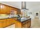 Modern kitchen featuring granite counters, custom cabinets, and center island with cooktop at 1408 Aramore Dr, Conyers, GA 30013