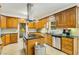 Spacious kitchen with wooden cabinets, granite countertops, and stainless steel appliances at 1408 Aramore Dr, Conyers, GA 30013