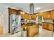 Well-equipped kitchen with stainless steel appliances, custom cabinetry, and a central island at 1408 Aramore Dr, Conyers, GA 30013
