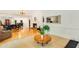Open-concept living area showcasing hardwood and tile flooring, a fireplace, and stylish furniture at 1408 Aramore Dr, Conyers, GA 30013
