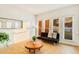 Bright living room featuring natural light, a cozy futon, and a decorative plant at 1408 Aramore Dr, Conyers, GA 30013