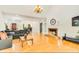 Open concept living room featuring hardwood floors, a fireplace, and an open floor plan at 1408 Aramore Dr, Conyers, GA 30013