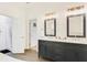 Spacious main bathroom featuring double vanity, and a walk-in shower at 1408 Aramore Dr, Conyers, GA 30013