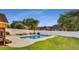 Pool with patio area, surrounded by a fence and mature trees at 1408 Aramore Dr, Conyers, GA 30013