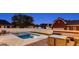 Backyard oasis with a refreshing pool, surrounding patio, and comfortable seating for outdoor relaxation at 1408 Aramore Dr, Conyers, GA 30013