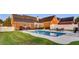 Backyard with in-ground pool, spacious patio, and lush landscaping at 1408 Aramore Dr, Conyers, GA 30013