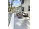 Outdoor deck, ideal for entertaining, with stylish seating and a striped rug in a partially shaded setting at 3228 Huntwood Dr, Decatur, GA 30034