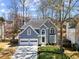 Charming two-story home featuring a gray exterior, manicured landscaping, and a two-car garage at 3752 Upland Dr, Marietta, GA 30066