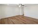 A spacious bedroom featuring a ceiling fan and wood floor at 3900 Allegretto Cir # 51, Atlanta, GA 30339