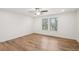 A bedroom showing hardwood floors, two windows, and a ceiling fan at 3900 Allegretto Cir # 51, Atlanta, GA 30339