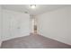 This bedroom features carpet, a closet, and a ceiling light at 3900 Allegretto Cir # 51, Atlanta, GA 30339