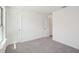 This bedroom features carpet, a closet, and a neutral color scheme at 3900 Allegretto Cir # 51, Atlanta, GA 30339