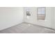 A bedroom with carpet floor and two windows at 3900 Allegretto Cir # 51, Atlanta, GA 30339