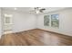 A bedroom featuring a view to the bathroom, wood floors, and windows at 3900 Allegretto Cir # 51, Atlanta, GA 30339