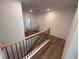 Hallway with railing and new hardwood floors at 3900 Allegretto Cir # 51, Atlanta, GA 30339