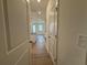 Hallway leading to a kitchen with stainless steel appliances at 3900 Allegretto Cir # 51, Atlanta, GA 30339