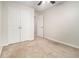 Bedroom featuring neutral carpet, a ceiling fan, and a double door closet for ample storage at 4273 High Park Ln # 15, Atlanta, GA 30344