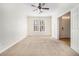 Bright bedroom featuring neutral carpet, ceiling fan, and ample natural light at 4273 High Park Ln # 15, Atlanta, GA 30344