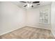Comfortable bedroom featuring neutral carpet, a ceiling fan, and a bright window at 4273 High Park Ln # 15, Atlanta, GA 30344