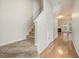 Bright hallway with hardwood floors and carpeted stairs at 4273 High Park Ln # 15, Atlanta, GA 30344