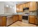 Modern kitchen featuring stainless steel appliances, granite countertops, and a mosaic backsplash at 4273 High Park Ln # 15, Atlanta, GA 30344