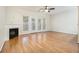 Spacious living room featuring a fireplace, hardwood floors, and French doors at 4273 High Park Ln # 15, Atlanta, GA 30344